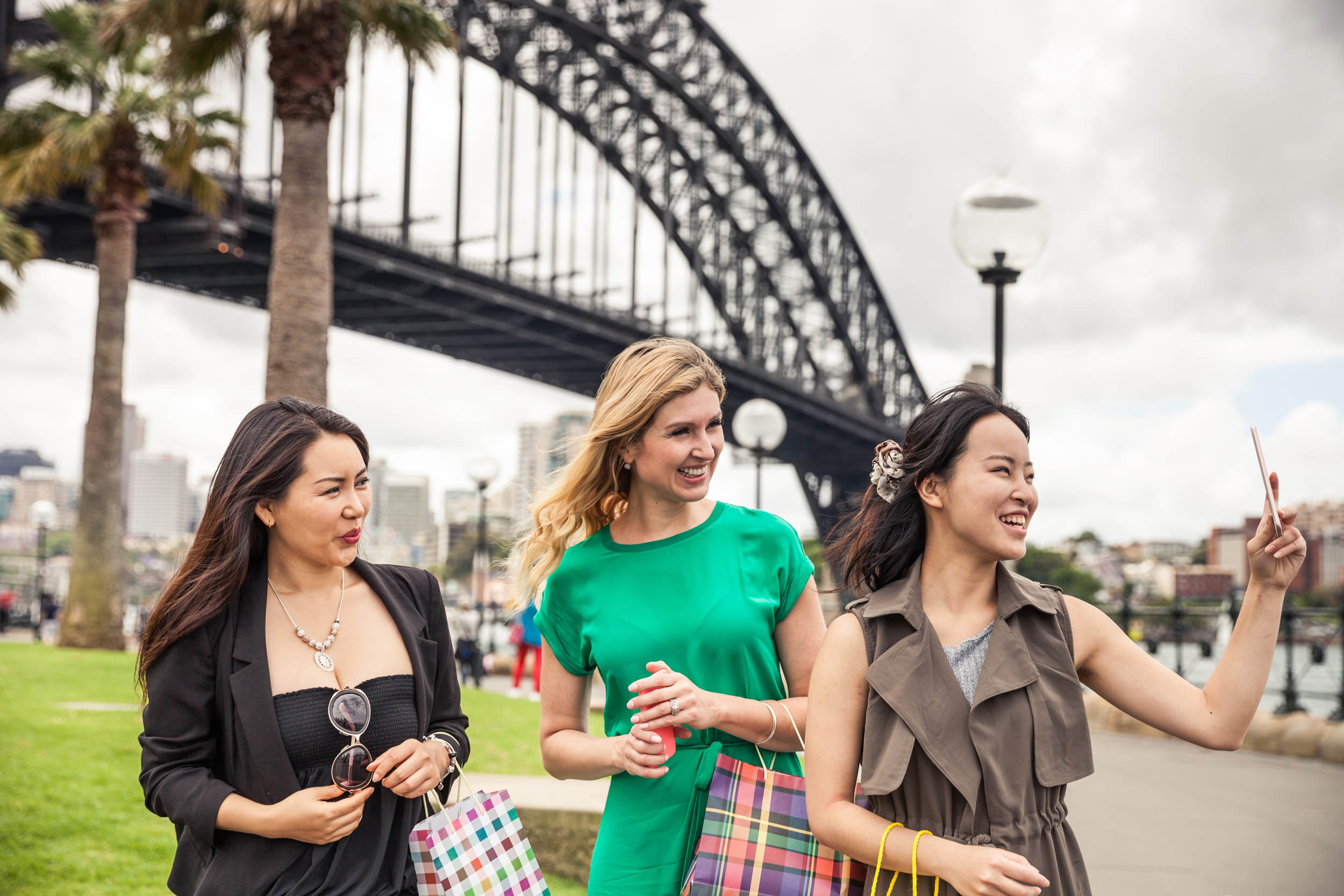 Happy women walking in Sydney downtown - Comparison Australia